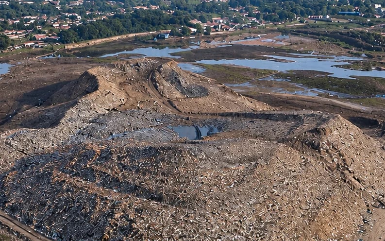 User-supplied after view identified as Bhalswa landfill, with excavated waste and machinery