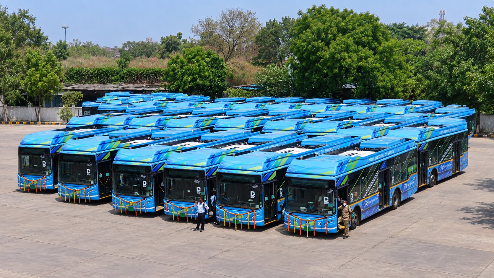 User-supplied photo of rows of blue electric buses parked at a depot